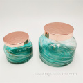 Swirled spots glass candle holder with metal lid